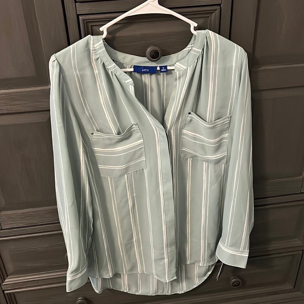 Woman’s green and white dress top